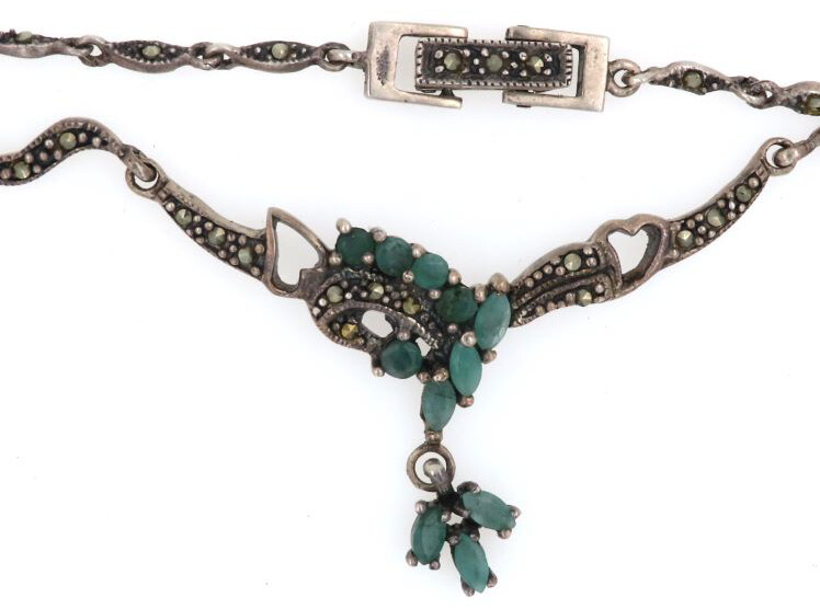 Close view of the necklace showing its green chrysoprase stones, marcasite and flowing silver setting